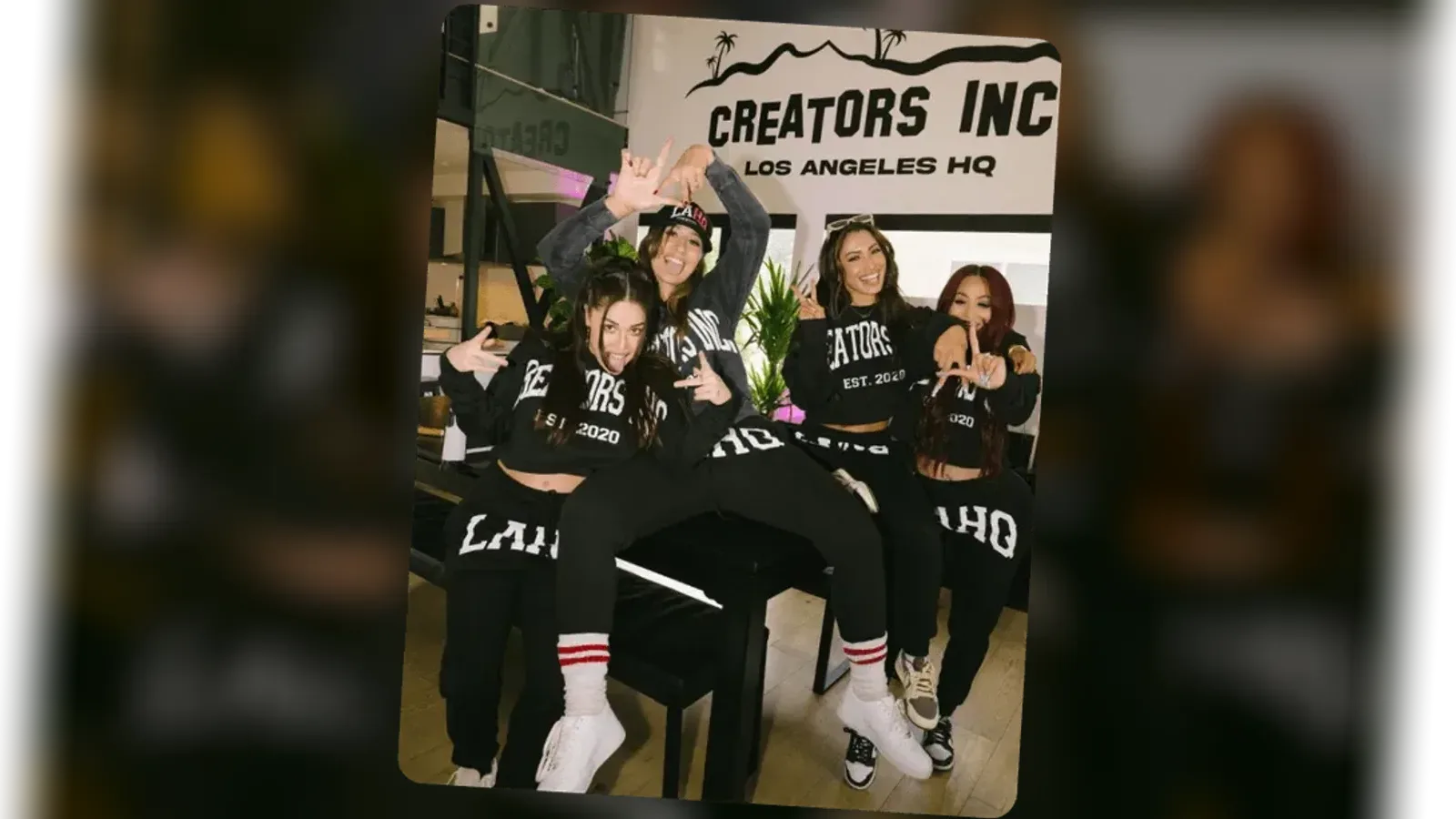 Four creators in matching Creators Inc hoodies and sweatpants posing together at the Los Angeles HQ