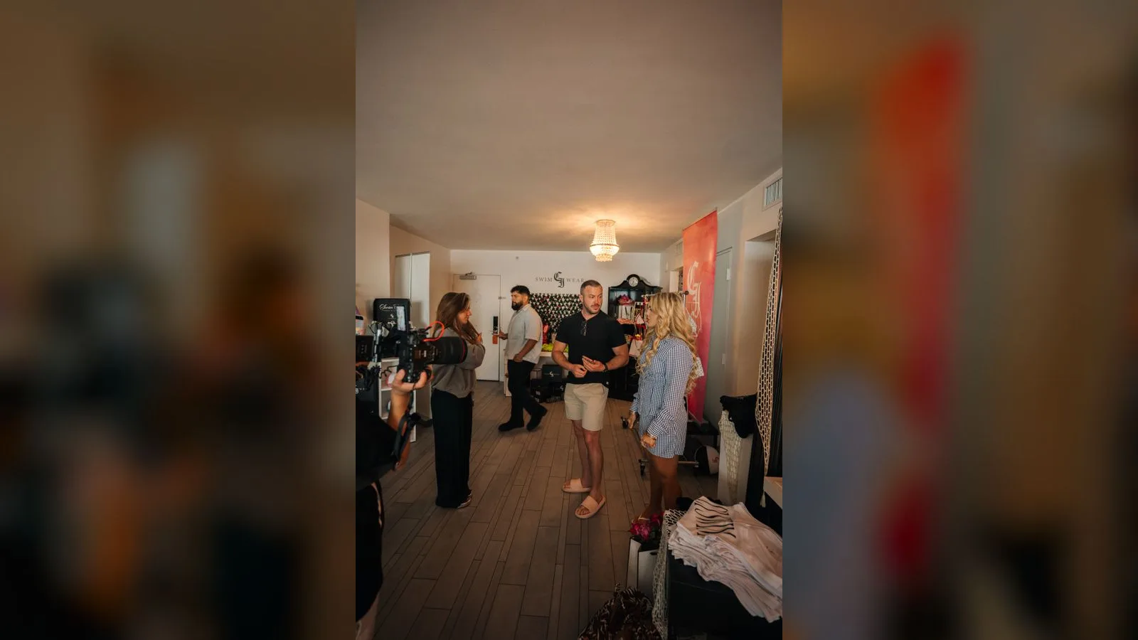 Founder and community members gathered during filming at a CI Swimwear showroom event